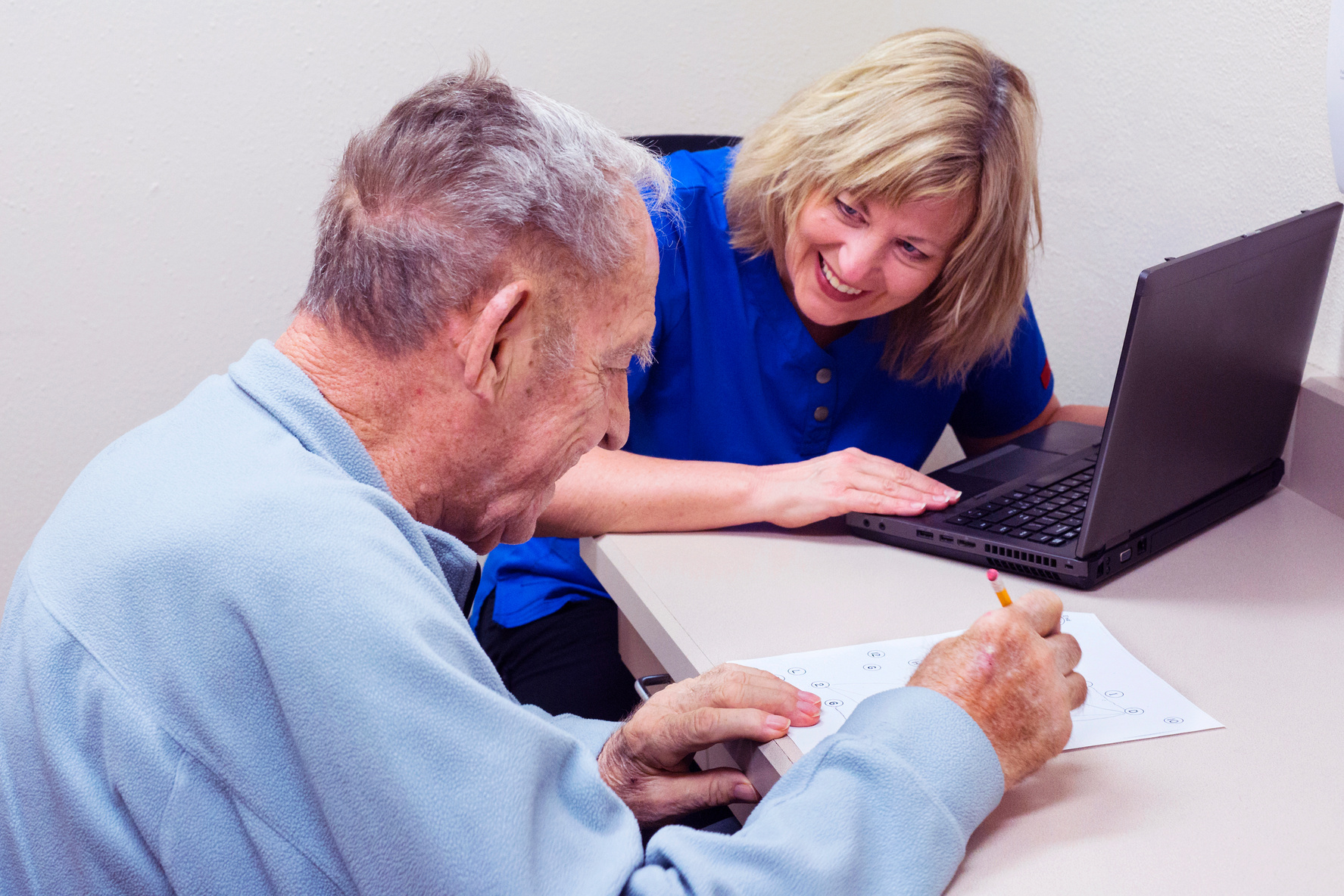 Senior man taking cognitive test in speech therapy session